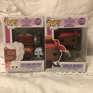 Two funko pops characters of the Proud family cartoon show